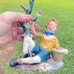 Small male figure of boy at Applebees tree